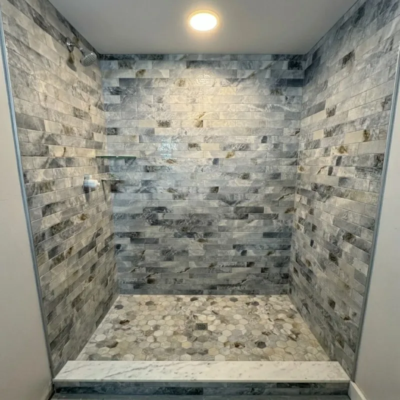 Bathroom after tile and fixture remodel by Paez And More